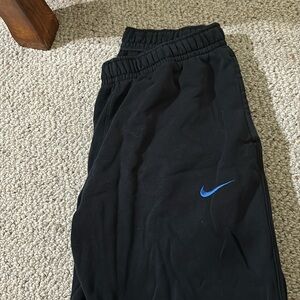 Nike black sweatpants. Limited edition. Blue Nike swoosh. Women’s medium.